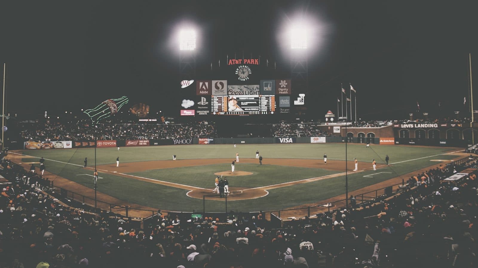 An empty baseball stadium at dusk