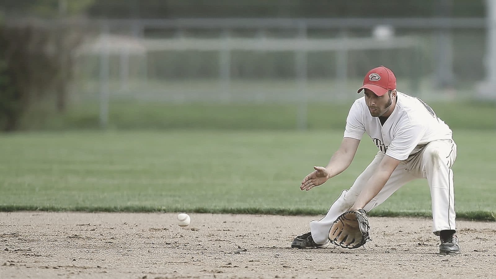 A baseball player in the outfield