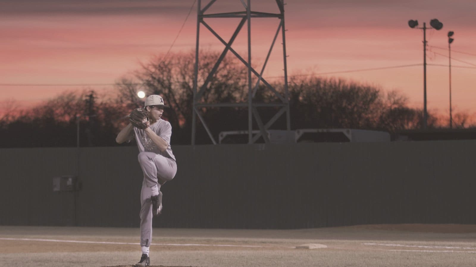 A baseball player fielding a ground ball